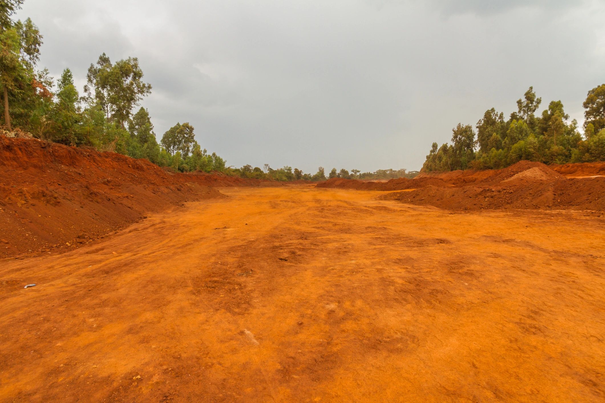 Red earth landscape in Africa representing mining environment