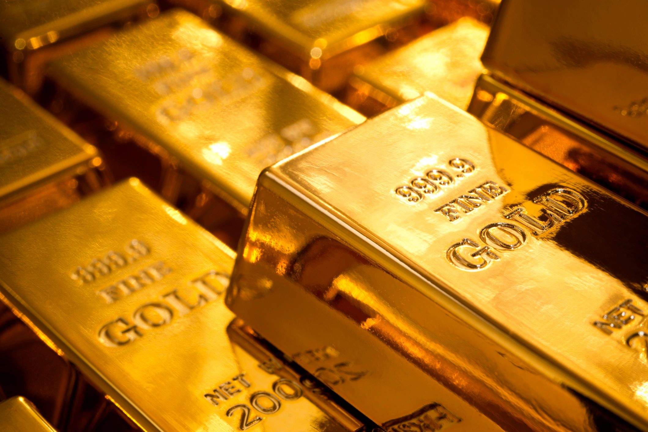 Processed gold bars representing refined output
